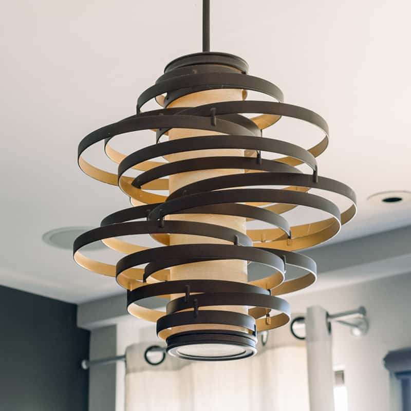 A contemporary circular chandelier with a sleek design, illuminating the space with modern elegance.