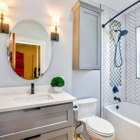 Bathroom-Remodeling-3 A white toilet and sink in a bathroom.