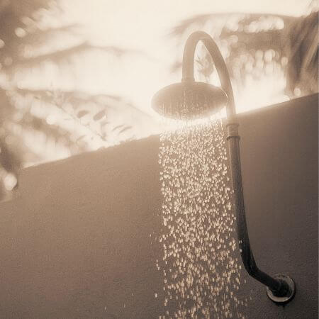 Shower-Remodeling-3 A black and white image featuring a shower head, highlighting its modern shape and texture.
